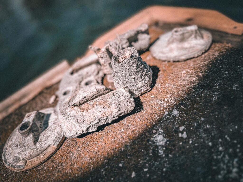 Worn zinc anodes requiring replacement during underwater boat inspection