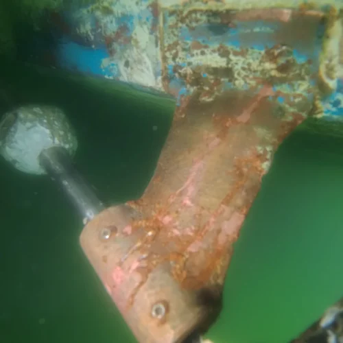 Corroded propeller shaft strut found during underwater boat inspection